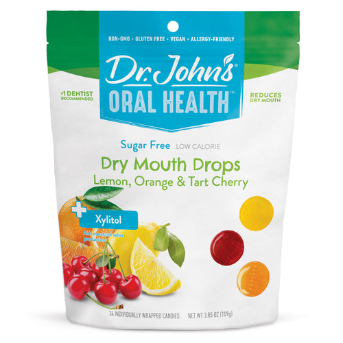 Packaging of Dr. John's Oral Health Dry Mouth Drops with lemon, orange, and tart cherry flavors on a white background.