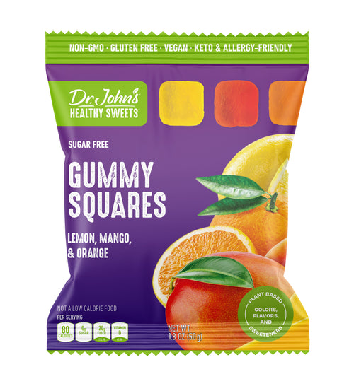 A package of Dr. John’s Healthy Sweets Gummy Squares Tropical Fruit Mix Candies with lemon, mango and orange flavors with a white background