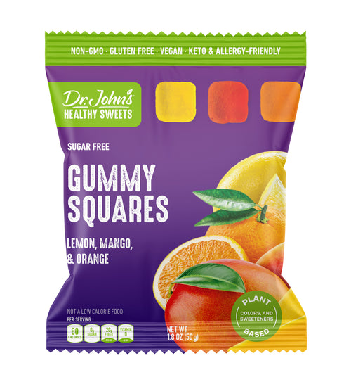 A bag of Dr. John's Healthy Sweets Gummy Squares, lemon, mango, and orange flavor, in a purple and green package with fruit illustrations.